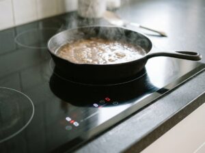 Induction cooktop heating a pan